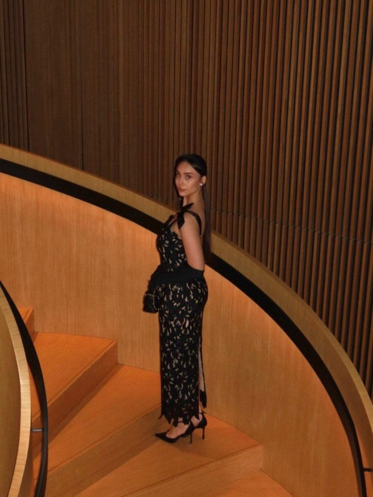 Bella Barnett — black lace dress with opera gloves, frame 3